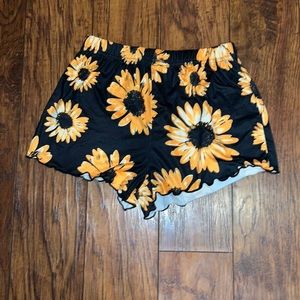 Black shorts with sunflower around the hole shorts size x small but affordable